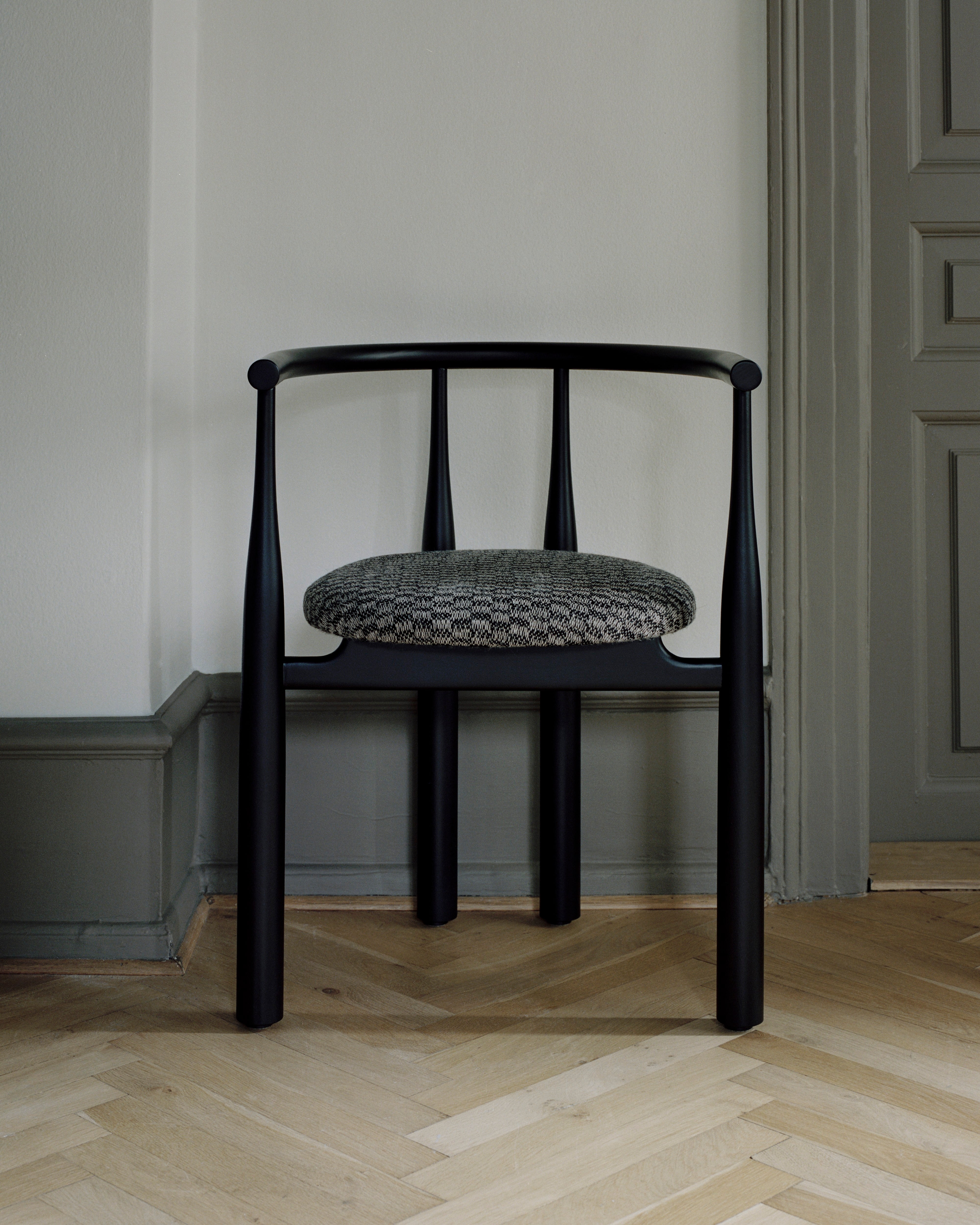 Bukowski chair upholstered with a black beech base