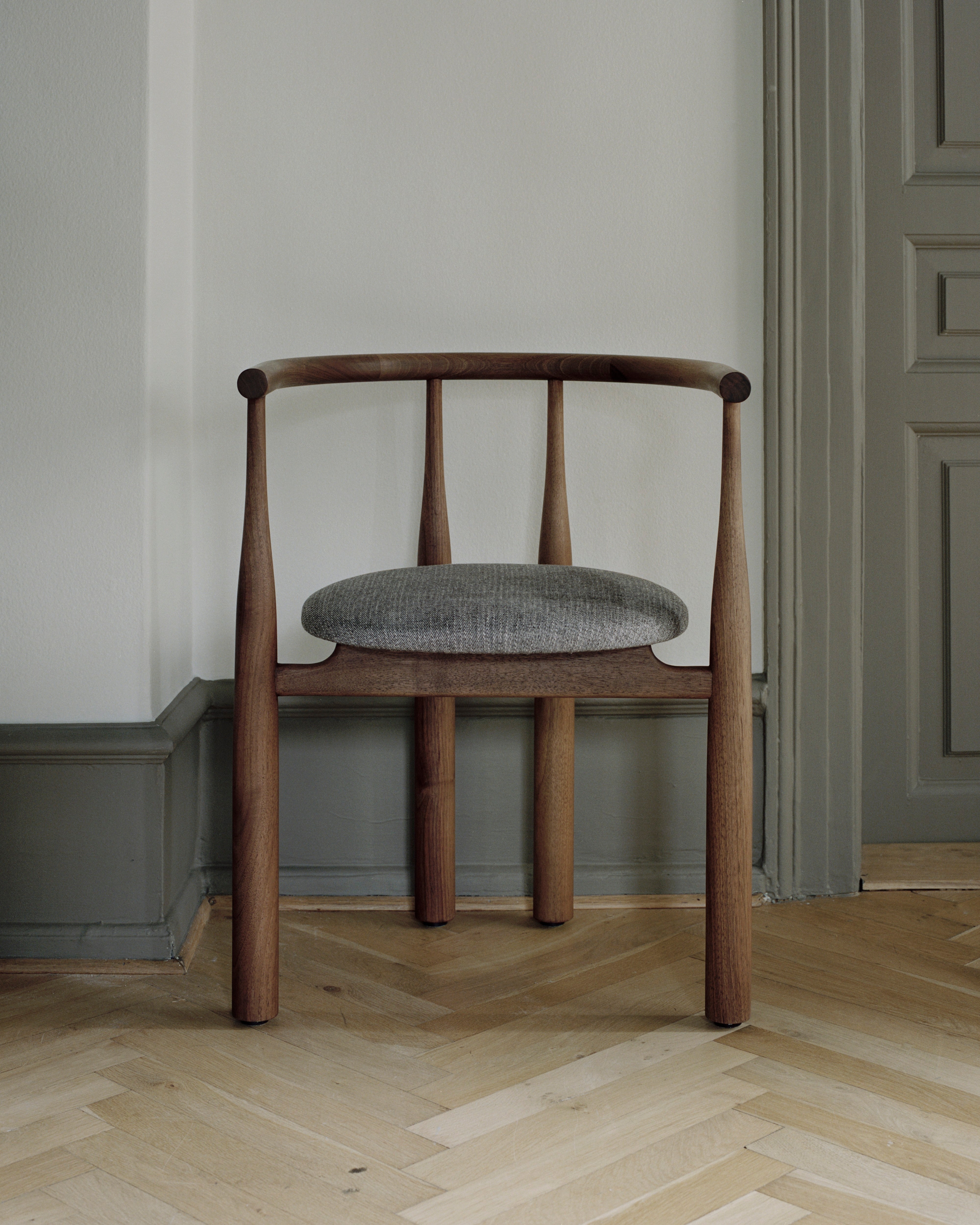 Bukowski chair upholstered with a nut base