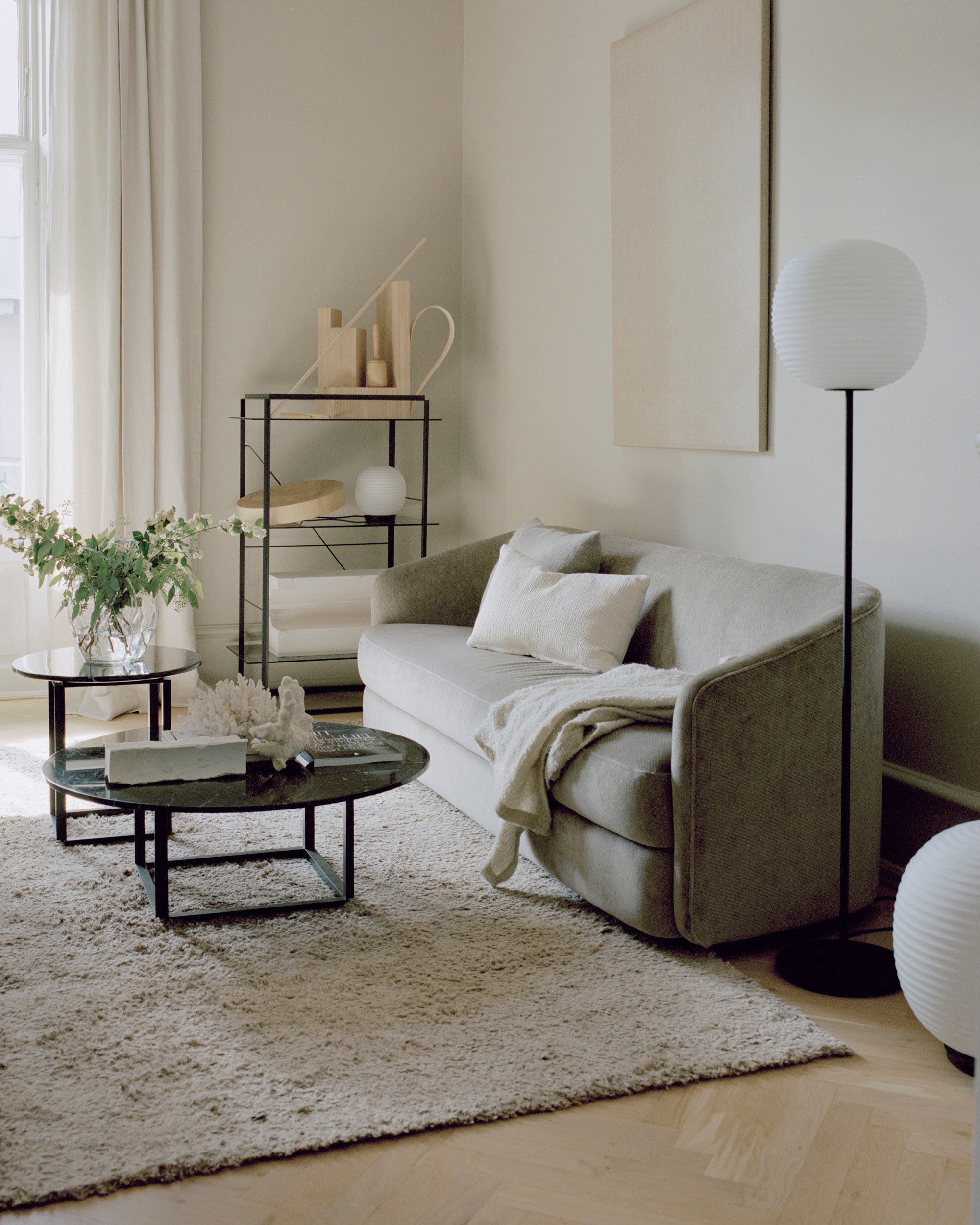 Lantern white floor lamp with a black base