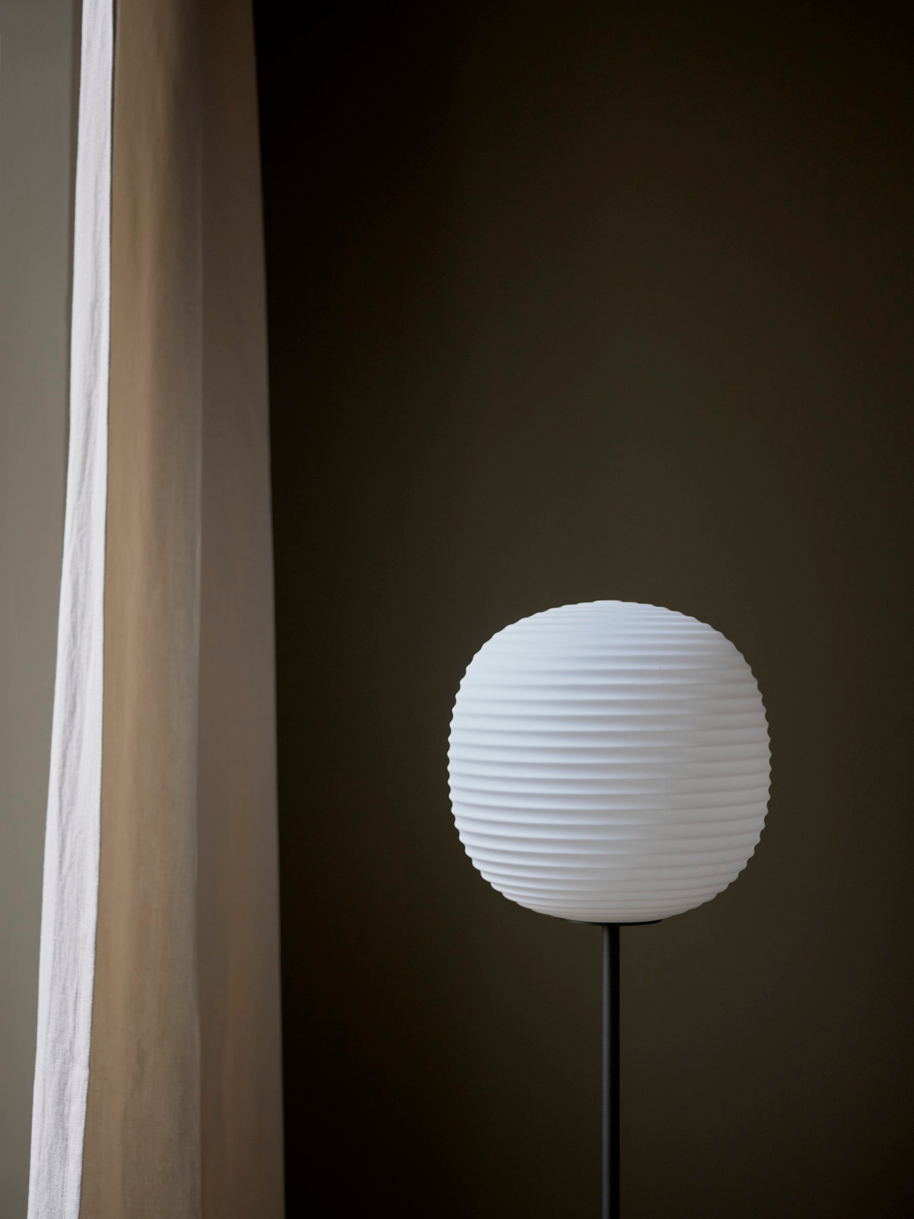 Lantern white floor lamp with a black base