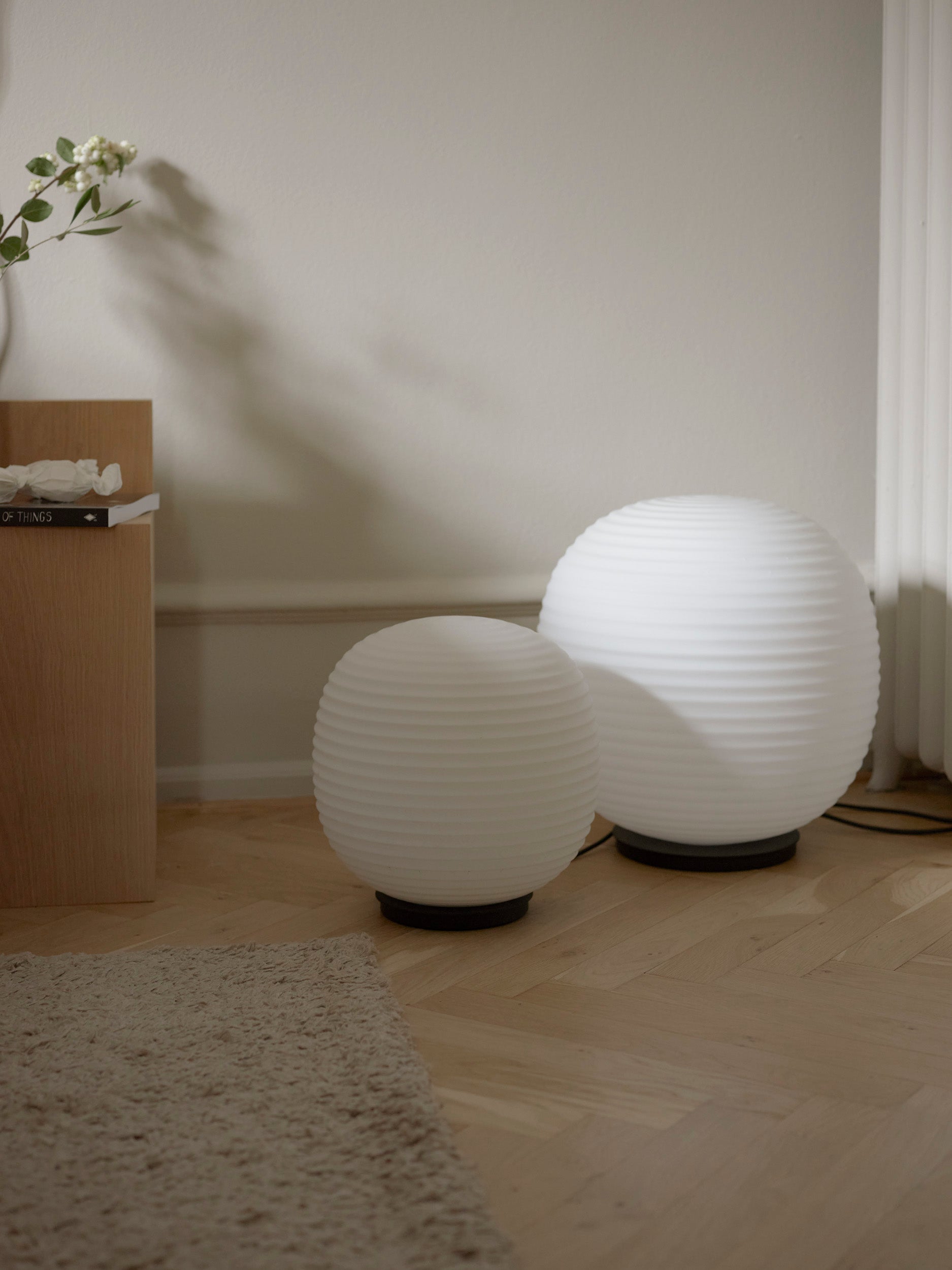 Lantern Globe white floor lamp with a black base