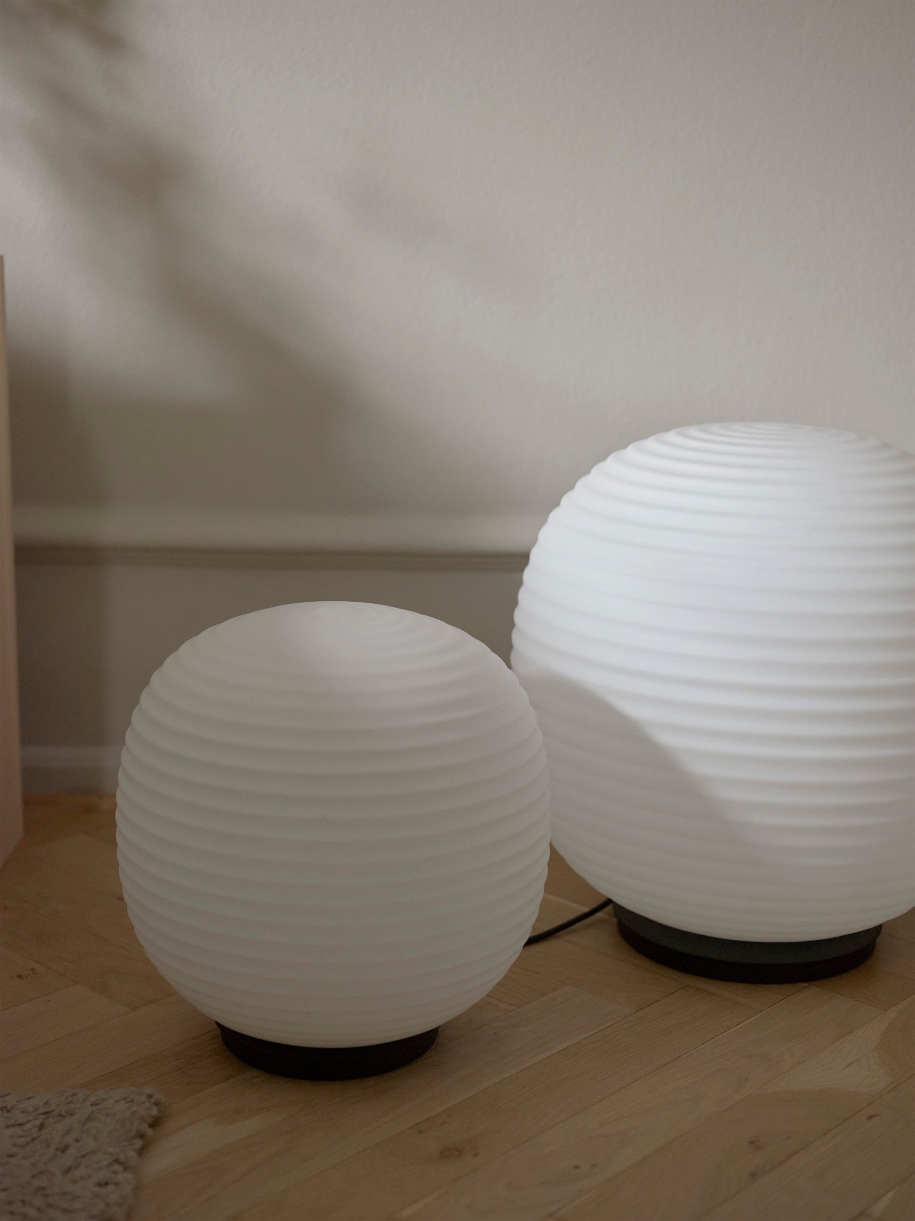Lantern Globe white floor lamp with a black base