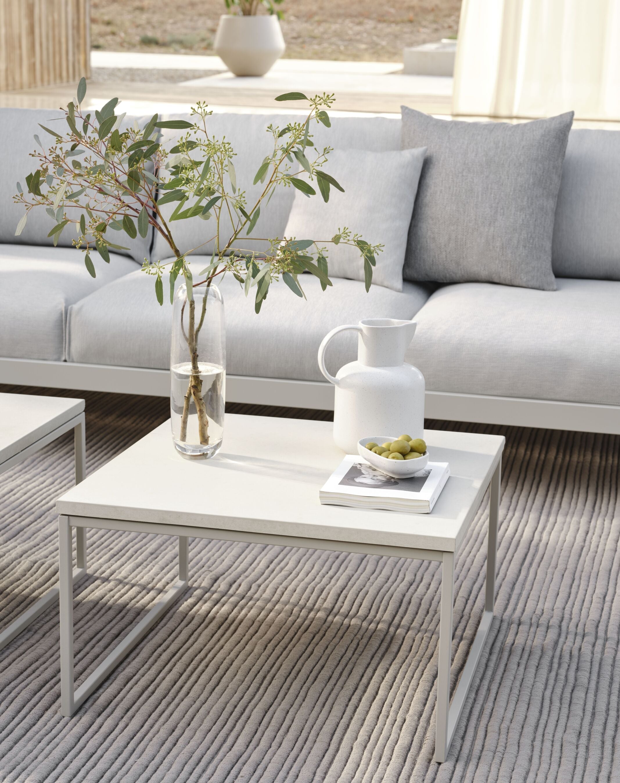 The external coffee table Como wooden top with a gray base