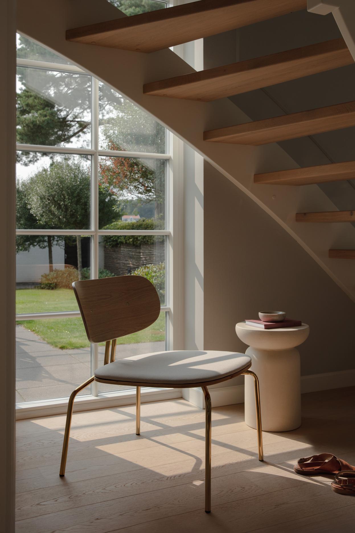 Curious armchair brown plush with a black base