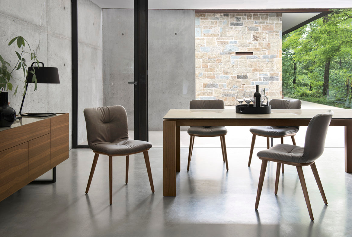 ANNIE SOFT upholstered chair with a black wooden base