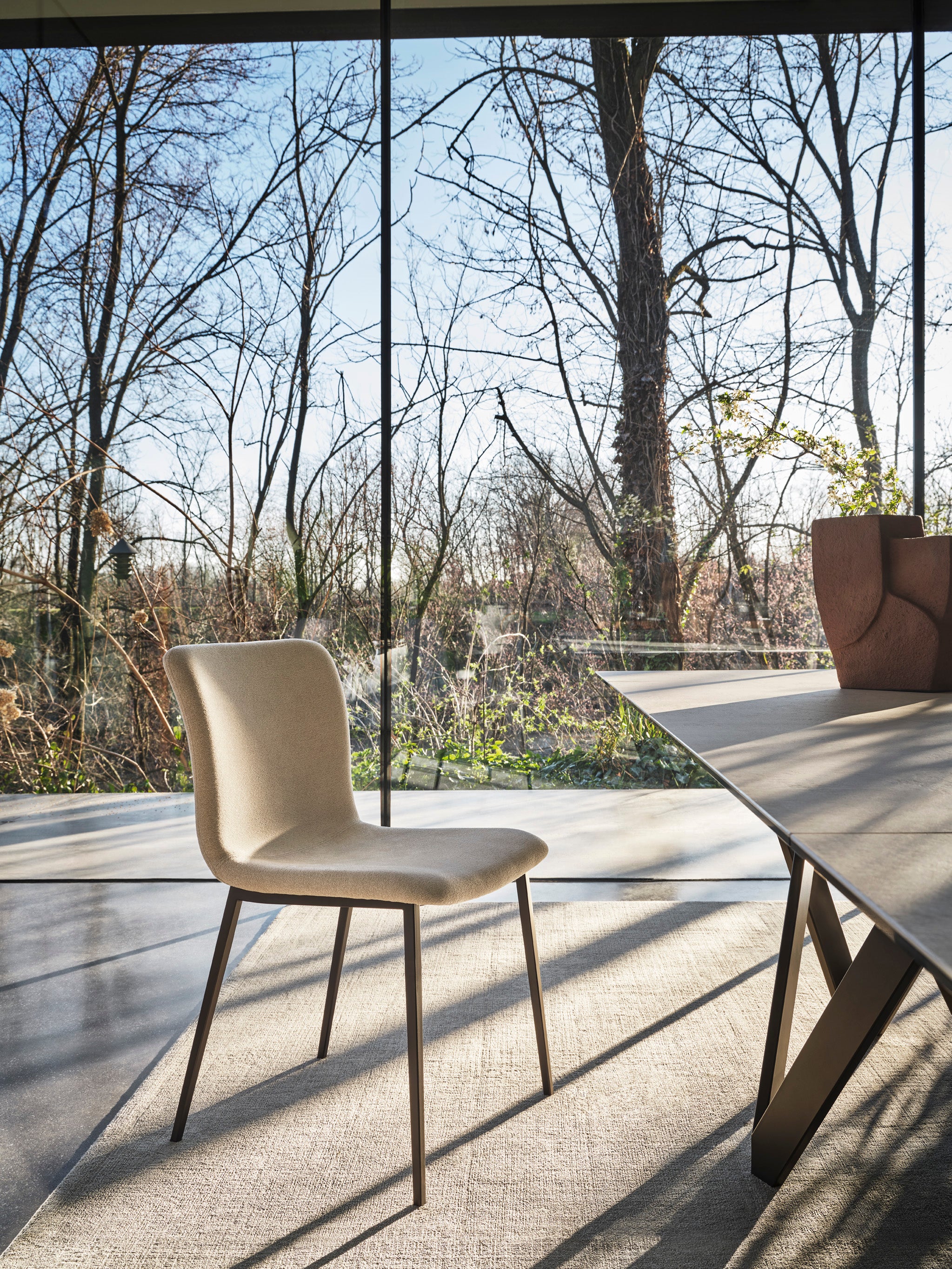 ANNIE upholstered chair with a brown metal base