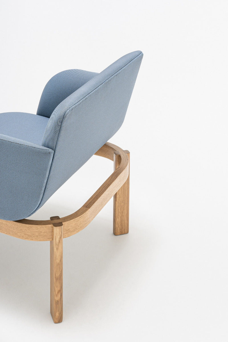 Upholstered chair of the ramp, wooden base