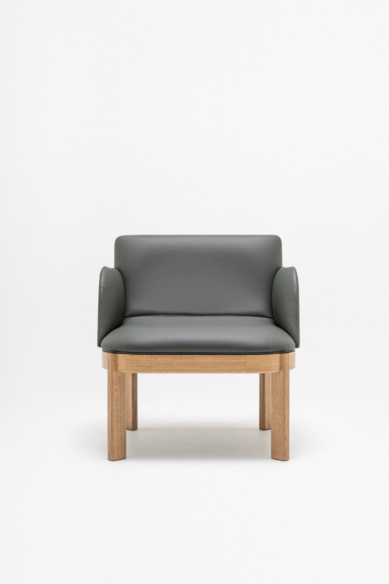 Upholstered chair of the ramp, wooden base