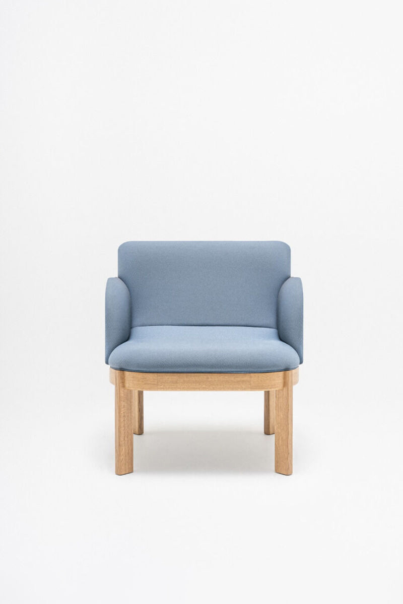 Upholstered chair of the ramp, wooden base