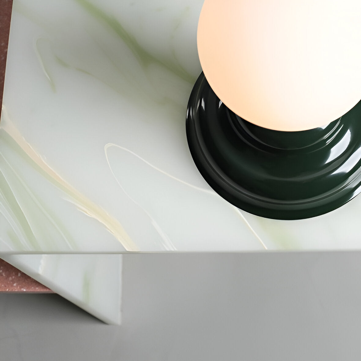 Table lamp with a glass lampshade green wave