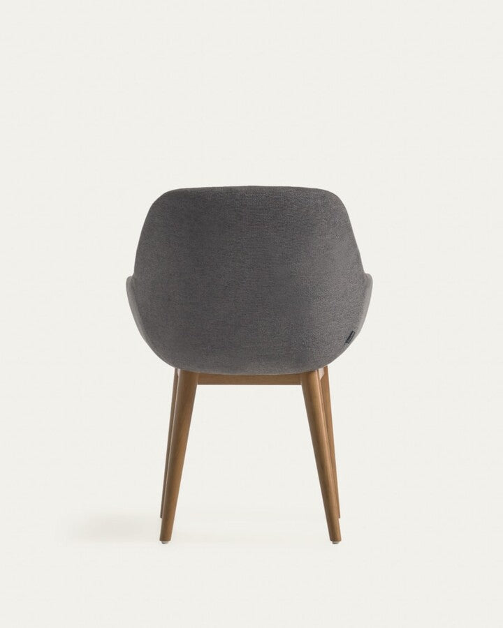 A chair in a dark gray carrier with ash base