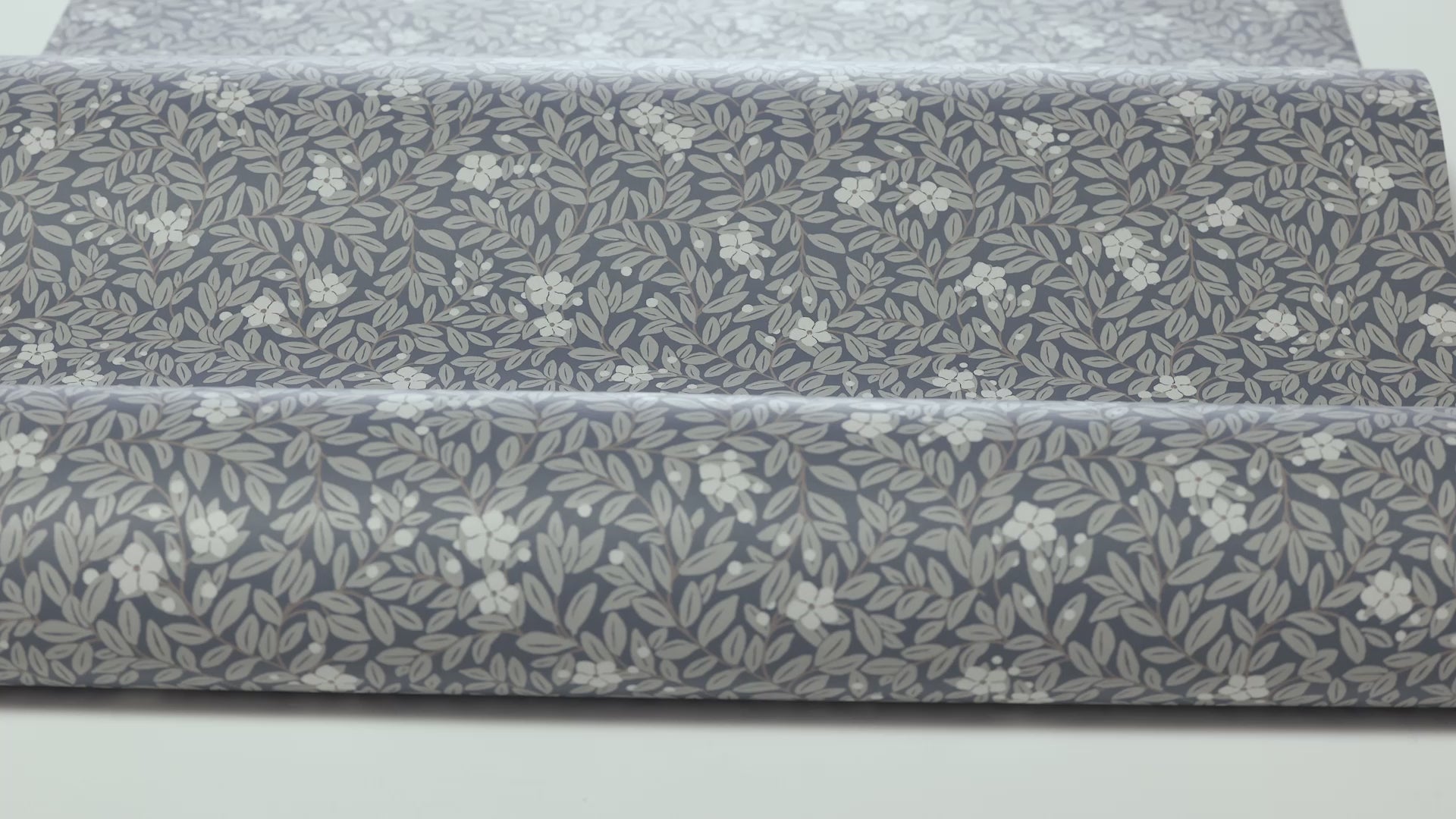 Wallpaper with a floral pattern of flowers and leaves MYRTEN blue with white