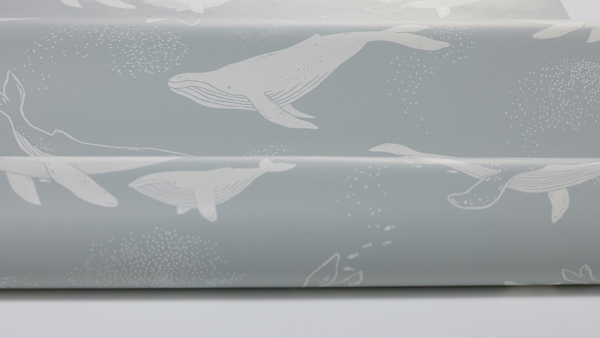 Children's wallpaper with a whale animal motif in blue and white