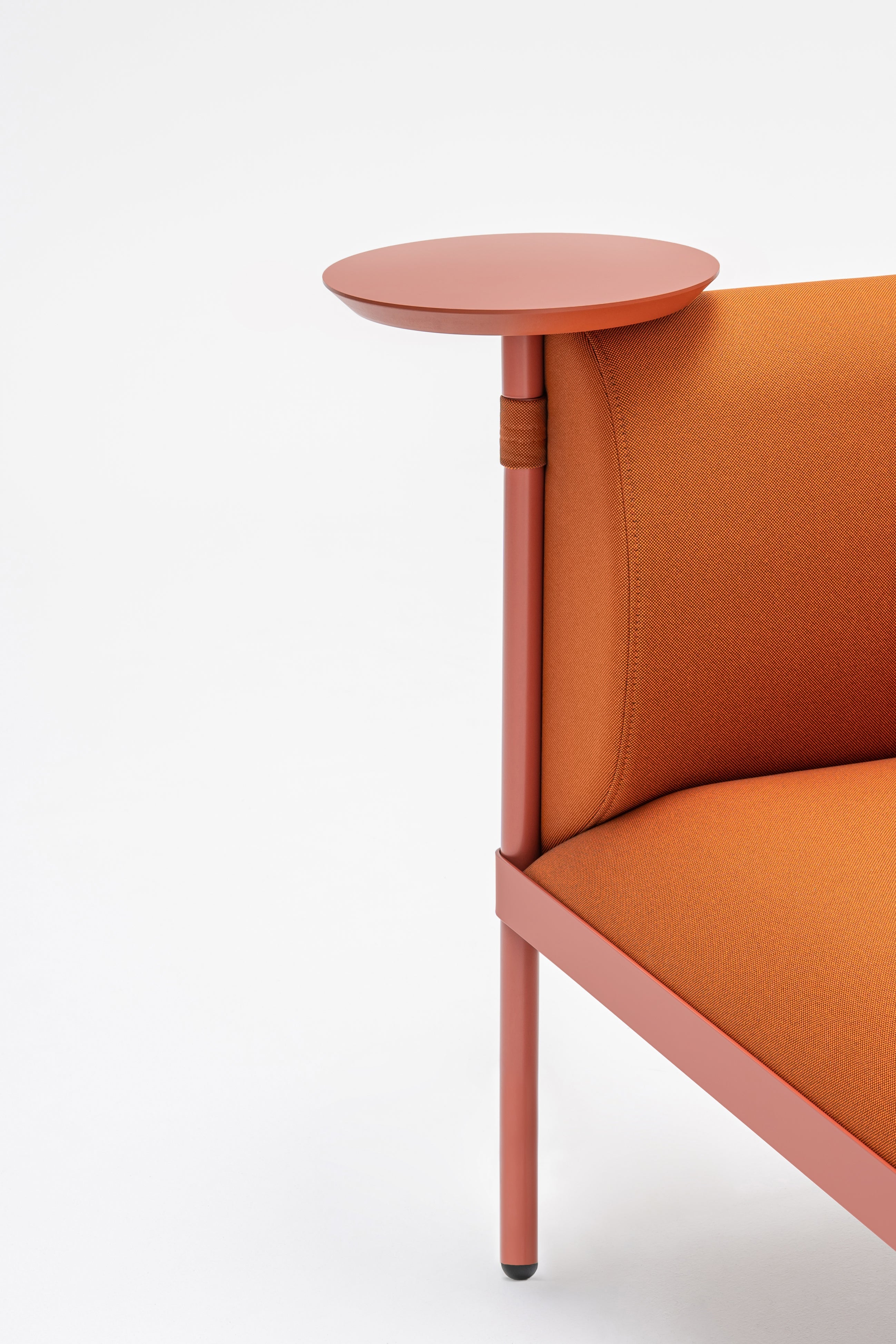 Low upholstered stilt armchair