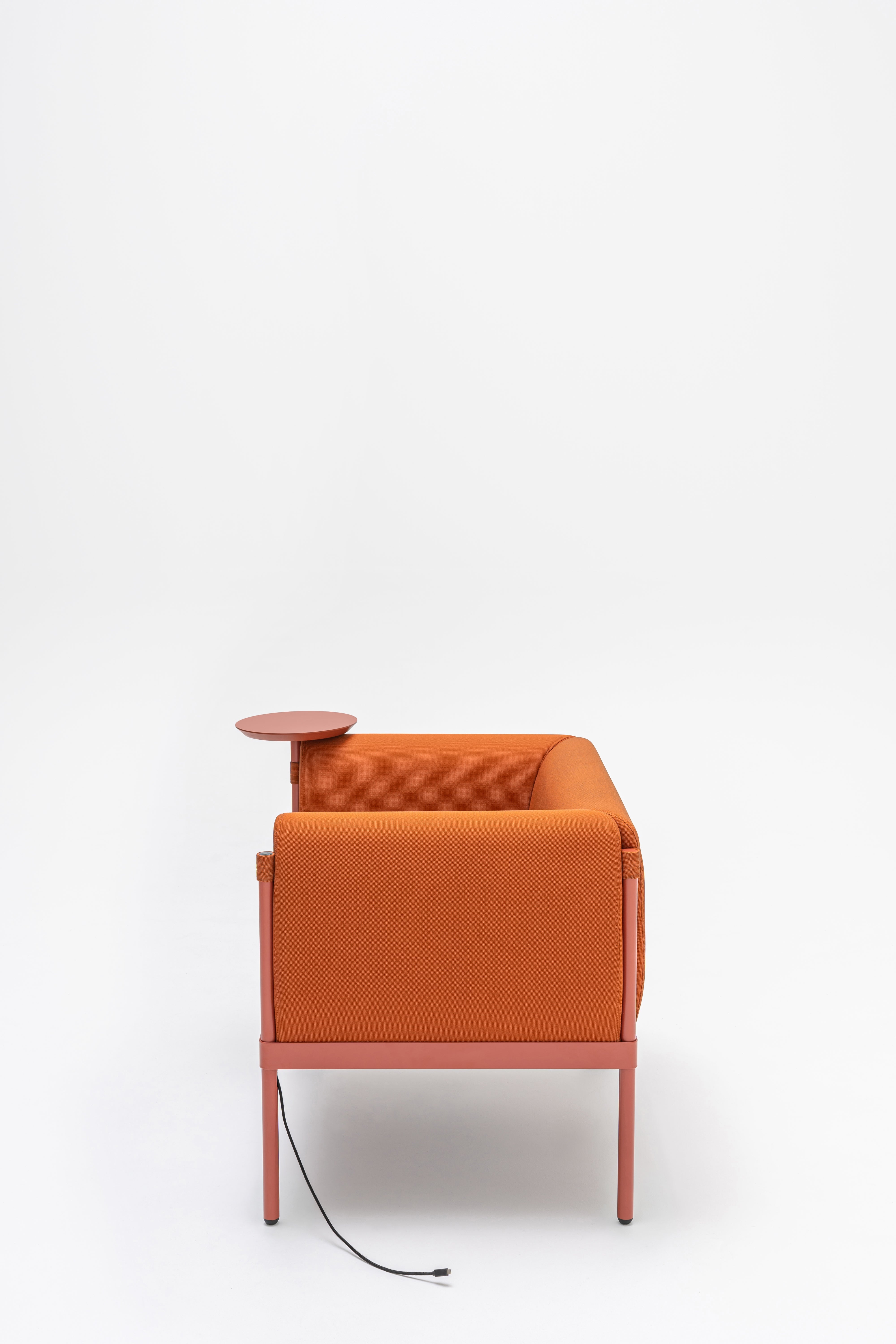 Low upholstered stilt armchair