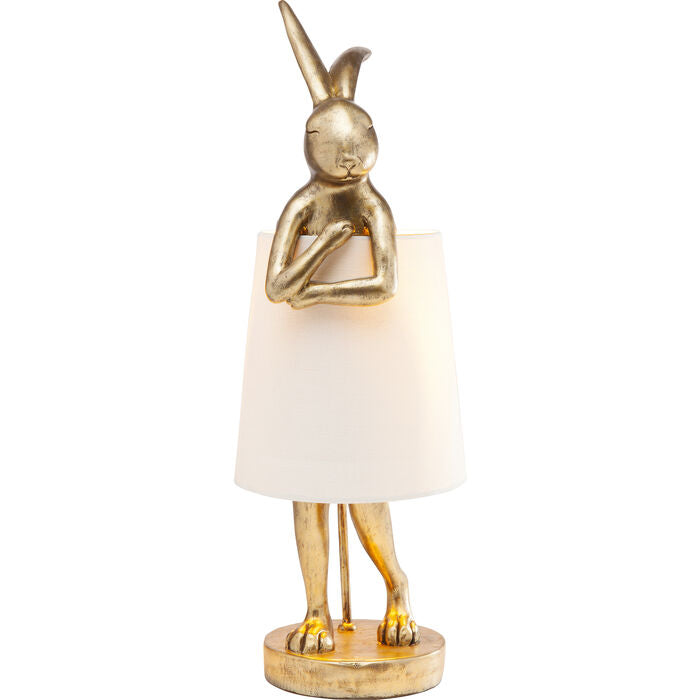 A bunny table lamp is a real collector's item with a large heart. The elegant golden look fits into a modern living room, thanks to its charm placed on a bedside table in a vintage bedroom, it will take care of 