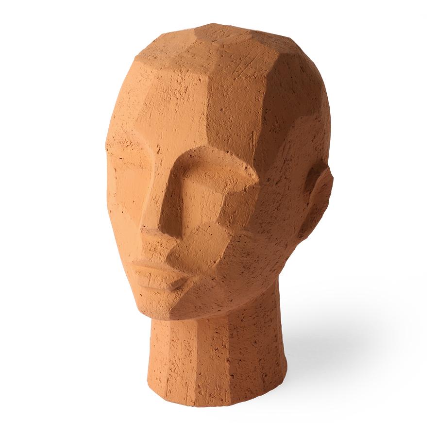 The uniqueness of the room is largely determined by accessories. If you are looking for something not obvious, then certainly an abstract sculpture of the head of terracotta, it will meet expectations, even if they are very demanding. Faithfulness to the mapping will be great in a modern living room as an accessory on a dresser. A minimalist dining room, in which you need a decoration that makes the effect of uniqueness, while not overwhelming it, will definitely like this figurine.
