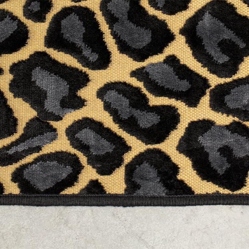 The Bold Monkey Ame's A Wild World Baby Panther rug is a simple way to change the character of the room. It is a vocal point for minimalist interiors or a fun sparring partner for each room that is not afraid of a collision of prints.