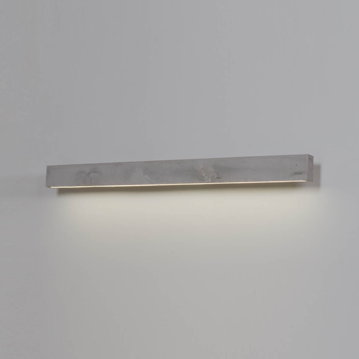 Concrete Line Wall is perfect for brave and modern interiors. It was made of concrete on steel handles and equipped with the highest quality LEDs. The lamp is hand -cast made of concrete, thanks to which each copy is unique and may differ from each other in texture and color.